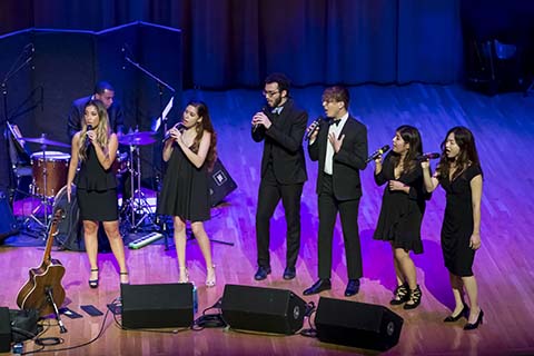 Vocal group performs live on stage