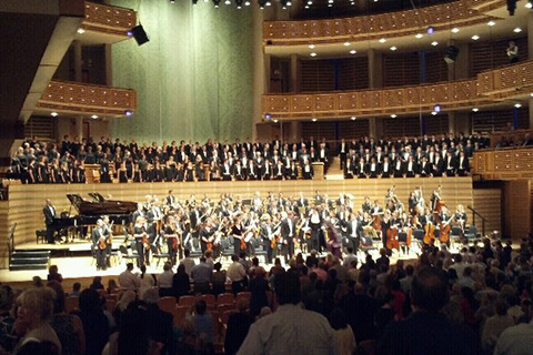 Choir and Orchestra play on stage
